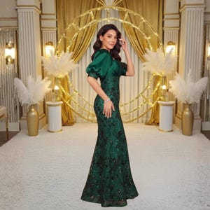 Elegant women's sequin satin gown featuring a flattering V neckline, half sleeves, fitted waist and full length silhouette. Ideal for black tie events, formal parties, weddings, evening occasions and special celebrations.