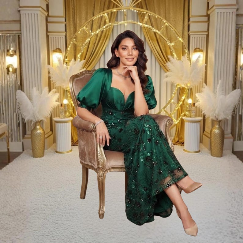 Beautiful satin evening dress with a waist cinched design, half lantern sleeves, shimmering sequin accents and an elegant V neck. A graceful formal maxi gown for prom, wedding receptions, galas and luxury events.