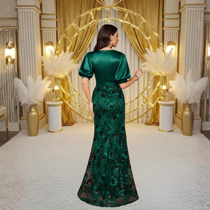 Luxury satin evening gown featuring a flattering V neck, half sleeves, shimmering sequin details and a fitted waist. This elegant maxi dress is ideal for wedding guests, formal parties, receptions, proms and elegant celebrations.