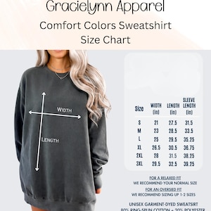 Puede incluir: Tabla de tallas para una sudadera Comfort Colors de Gracielynn Apparel. La tabla muestra las medidas de ancho, largo y largo de manga en pulgadas para las tallas S a 3XL. La sudadera es unisex, te&ntilde;ida en prenda y est&aacute; hecha de 80% algod&oacute;n hilado en anillo y 20% poli&eacute;ster.