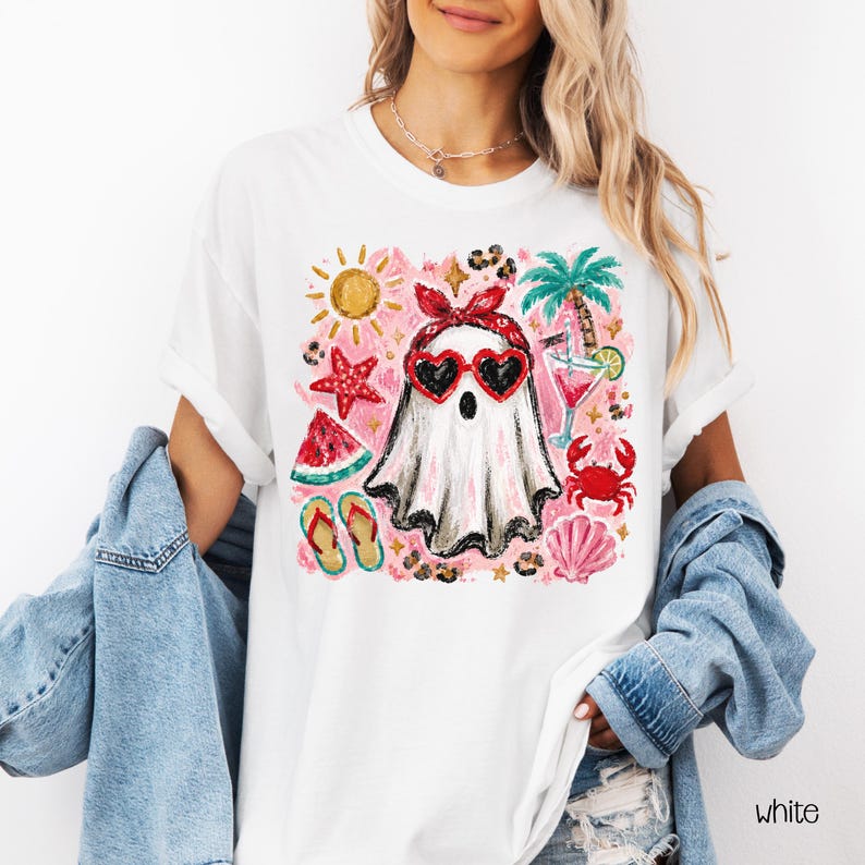 May include: White t-shirt featuring a ghost wearing heart-shaped sunglasses and a red bandana, surrounded by summer-themed illustrations like a sun, palm tree, and watermelon. The word "white" is printed on the bottom right.