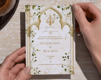 Puede incluir: Una tarjeta de invitación de boda con un diseño vintage. La tarjeta presenta detalles dorados, elementos florales y el texto "WE REQUEST THE HONOUR OF YOUR PRESENCE AT THE NIKAH CEREMONY OF SANAH HUSSAIN & BILAL KHAN". La tarjeta es sostenida por una persona.