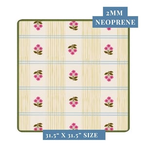 May include: A square neoprene mat with a floral pattern. The mat features a cream background with vertical stripes and square blocks containing pink flower clusters. The mat is 31.5" x 31.5" and 2mm thick.