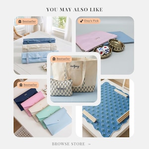 May include: A collection of mahjong accessories including rolled fabric mats in blue and beige, a canvas tote bag and matching pouch with mahjong text, envelope-style cases in various pastel colors, and a blue floral patterned game mat.