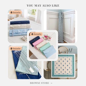 May include: A collection of mahjong accessories including rolled fabric mats in navy, beige, and light blue, envelope-style cases in various colors, a tall patterned fabric storage bag, a clear acrylic rack, and a square table mat with a blue floral pattern.