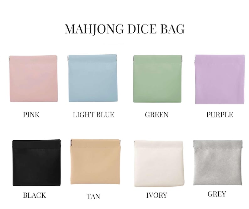 May include: A collection of eight small, square Mahjong dice bags in various colors: pink, light blue, green, purple, black, tan, ivory, and grey. Each bag has a simple, folded top design and is labeled with its color name.