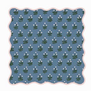 May include: A square, blue floral pattern with a scalloped pink border. The pattern features small white flowers and green leaves arranged in a repeating design. The overall aesthetic is reminiscent of vintage wallpaper or fabric.