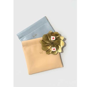 May include: A handmade wooden sign with the text "Welcome" in a playful font. The sign features a distressed white background and a dark brown border, perfect for a front door or entryway. Measures approximately 12 inches wide.