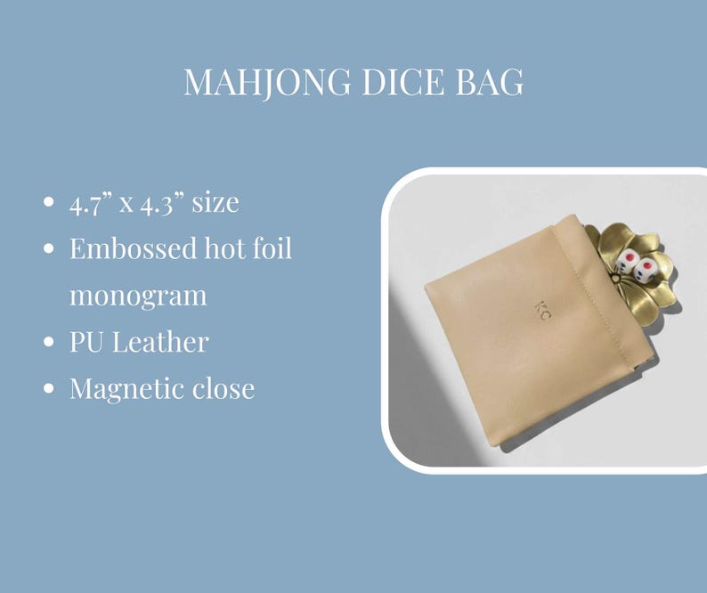 May include: A beige PU leather Mahjong dice bag with a magnetic closure, embossed monogram, and a gold-colored flower-shaped dice holder. The bag measures 4.7" x 4.3". Two dice are visible in the holder.