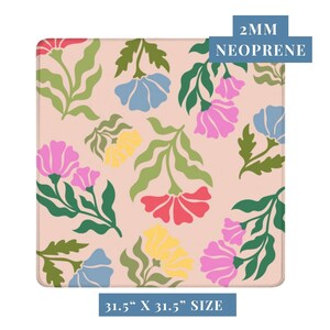 May include: A square mousepad with a floral pattern. The design features pink, red, yellow, and blue flowers with green leaves on a light pink background. The mousepad is 31.5" x 31.5" and made of 2mm neoprene.