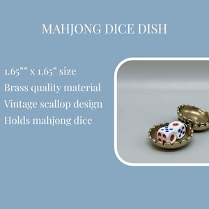 May include: A brass mahjong dice dish with a vintage scallop design. The dish is 1.65" x 1.65" and holds mahjong dice. Two dice with red and blue markings are visible inside the dish.