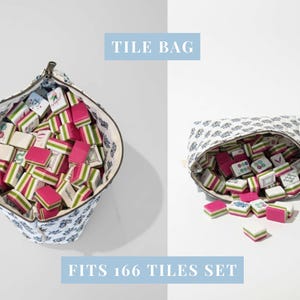 May include: A patterned tile bag, filled with colourful tiles. The tiles are pink, green, and white. The text "TILE BAG" and "FITS 166 TILES SET" are displayed in light blue.