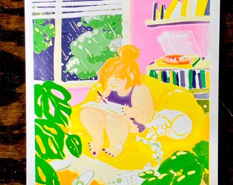 May include: A woman sits in a yellow beanbag chair with a white dog at her feet. She is drawing in a notebook and there is a record player behind her. The room is decorated with a pink wall and a window with green plants outside.