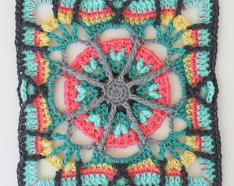 May include: A square crochet motif featuring a central gray circle with radiating spokes, surrounded by concentric layers of pink, teal, yellow, and dark gray yarn. The design incorporates openwork sections and a geometric border pattern.