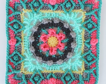 May include: A square crochet motif featuring a central yellow flower surrounded by dark gray, light blue, pink, and yellow yarn. The intricate design includes textured stitches and geometric patterns, with the word Pattern printed at the bottom.
