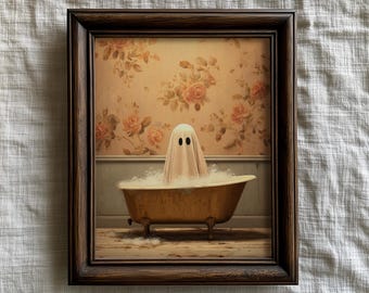 May include: A framed print featuring a whimsical ghost in a bathtub filled with bubbles. The ghost is draped in a white sheet with black eyes. The vintage-style bathroom has a floral wallpaper background and a claw-foot tub.