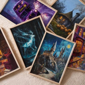 May include: Five framed paintings with different themes. The first painting is a purple and blue scene with a double-decker bus. The second painting is a blue and white scene with a stag and a forest. The third painting is a blue and white scene with a castle. The fourth painting is a blue and green scene with a cottage. The fifth painting is a colorful scene with a building with the text "OLLIVANDER'S" on the front.