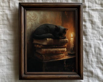 May include: A framed print depicts a black cat sleeping atop a stack of old books. A lit candle sits nearby, casting a warm glow. The artwork is in a dark wooden frame, creating a cozy, vintage aesthetic.