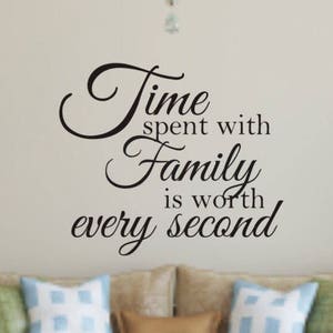 May include: Black and white wall decal with the quote "Time spent with family is worth every second".