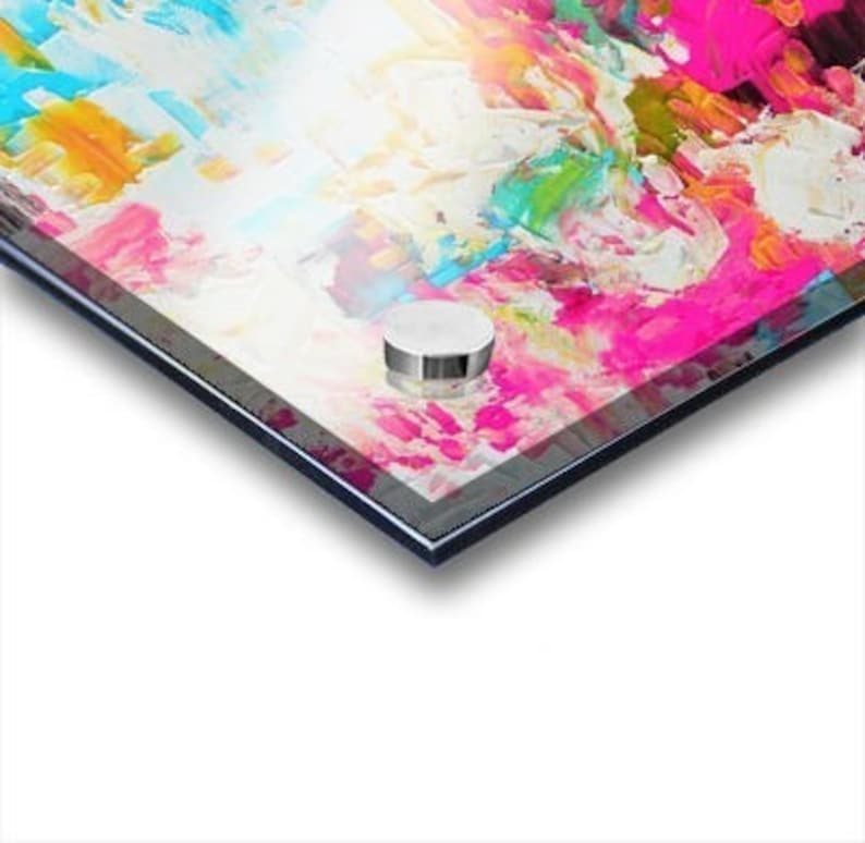 May include: An abstract painting on an acrylic panel featuring thick, textured impasto brushstrokes in vibrant shades of hot pink, bright yellow, turquoise blue, and white. The composition displays a high-gloss finish with a silver mounting bolt.
