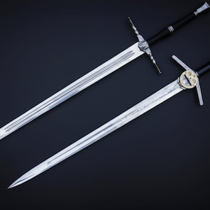 May include: Two long, silver swords with black handles and cross-shaped hilts are displayed against a dark background. One sword has a decorative circular element on the hilt. The blades are sharp and detailed.