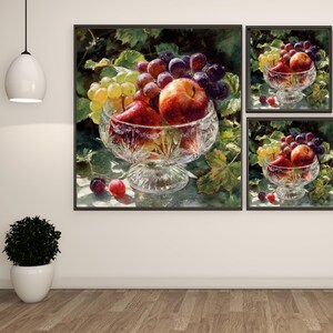 May include: A still life painting featuring a crystal bowl filled with red apples, green and purple grapes. The bowl is set against a backdrop of green leaves. The artwork is framed in a black frame.