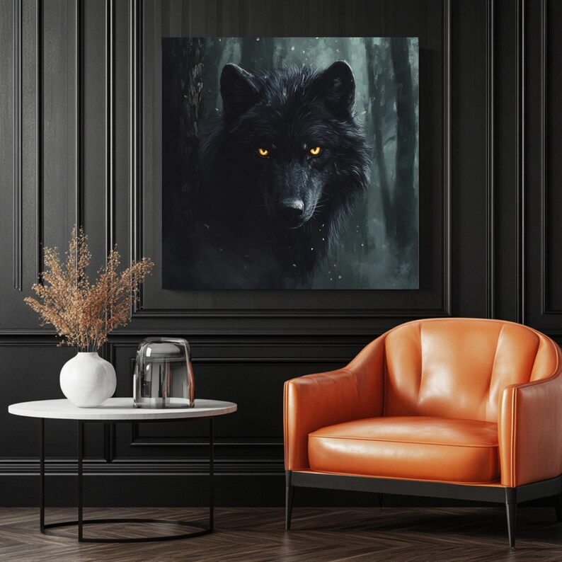 May include: A framed canvas art print featuring a black wolf with glowing yellow eyes, set against a dark forest backdrop. The artwork hangs above a modern orange leather armchair and a small white table with a vase.