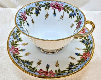Taza de té y platillo vintage Noritake de cáscara de huevo fina, pintados a mano, en rosa, azul y dorado con flores