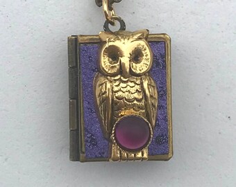 Owl Love Locket, purple and gold, holding 13 ways to tell someone you love them from English to American Sign Language.