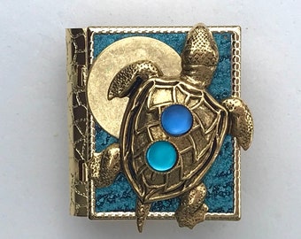 Miniature Book Pin - with a Sailing Story inside and an antique gold turtle and aquamarine cover design