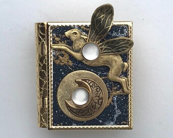 Miniature Book pin - with a story about the moon inside and a golden flying rabbit cover design