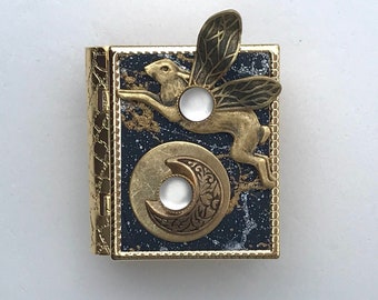 Miniature Book pin - with a story about the moon inside and a golden flying rabbit cover design