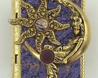 Miniature Book Pin – featuring an antique gold Moon Goddess and star design on the cover, with a Protection Spell hidden inside