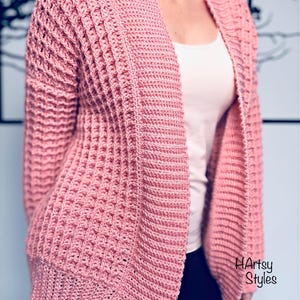 Cardigan con lavorazione a trecce in lana