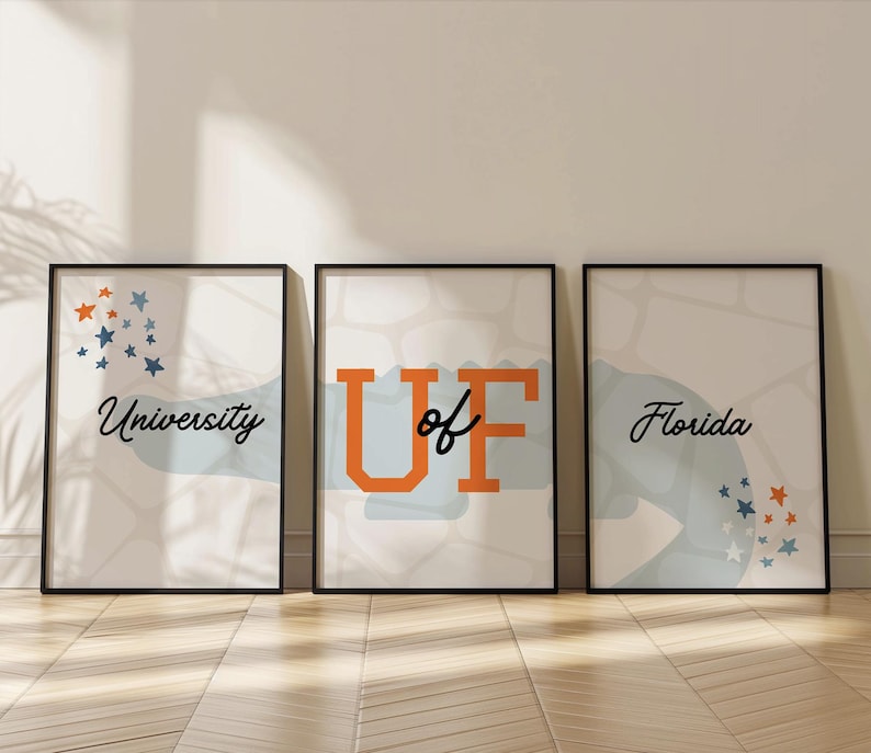 May include: Three framed prints with a light blue and white background. The first print says "University" in black cursive text. The second print says "UF" in orange and black text. The third print says "Florida" in black cursive text.