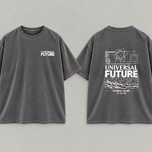 May include: A charcoal gray short-sleeve t-shirt with a crew neck. The front features the white text "UNIVERSAL FUTURE" on the left chest. The back displays a large white graphic with the text "UNIVERSAL FUTURE", "ISOLATION", "ETERNAL GLORY", and "CD DD CID" above a mountain landscape.