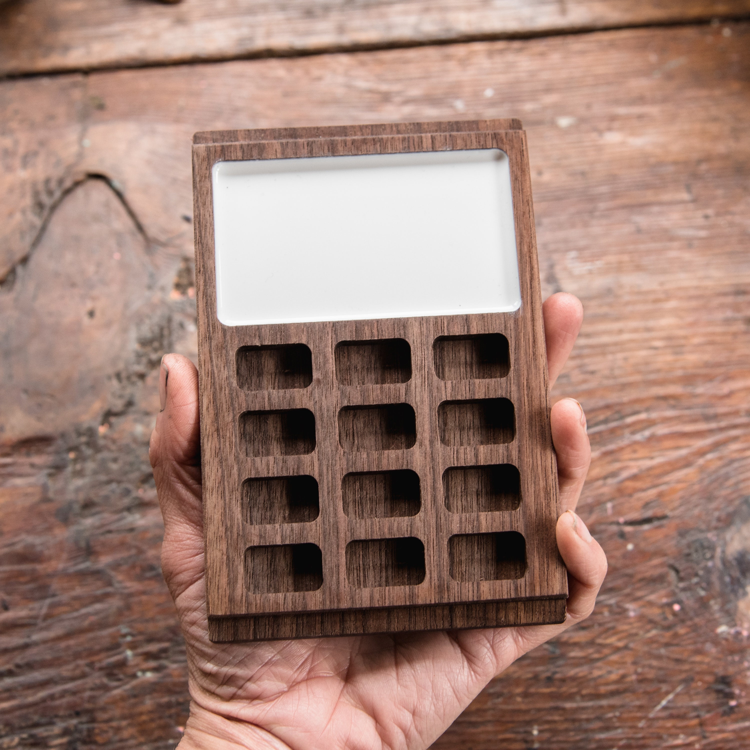 Premium Photo  White watercolor palette empty watercolor tray isolated on  wood background white palette