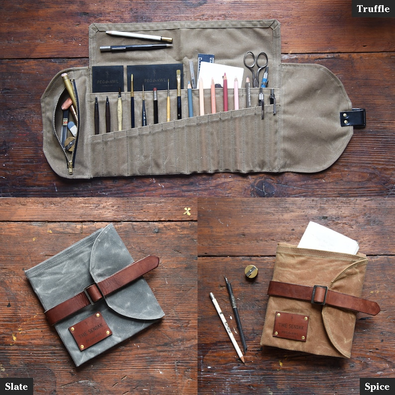 May include: A set of three canvas artist's roll-up pouches with leather straps and buckles. The pouches are labeled "The Sendak" and come in the colors truffle, slate, and spice.