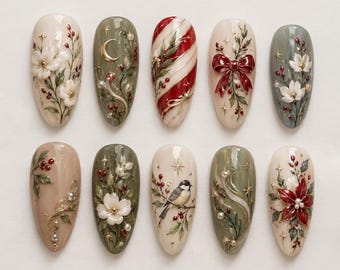 May include: A set of ten almond-shaped press-on nails featuring intricate holiday designs including white flowers, a gold crescent moon, red and white candy cane stripes, a red bow, a small bird, and red poinsettia accents with gold stars.