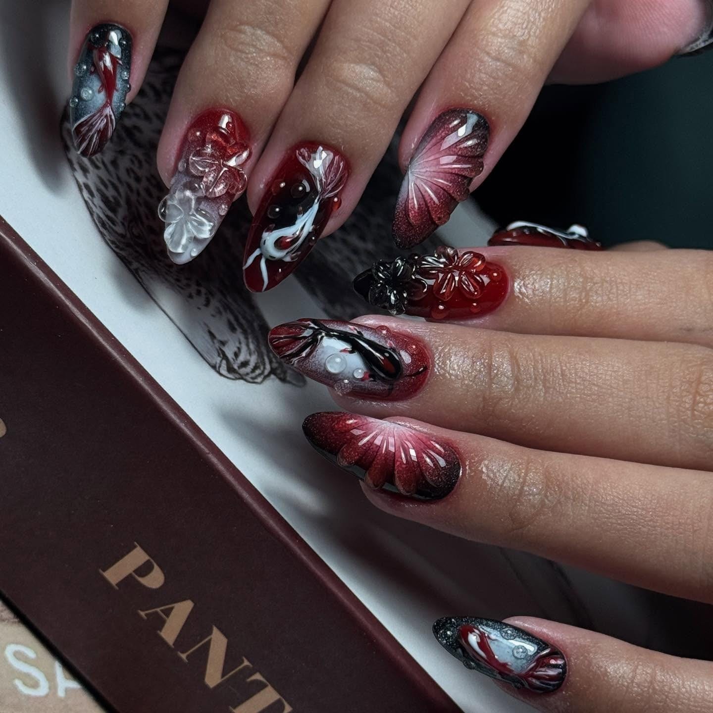 Radiant Red Swirl Nail Design