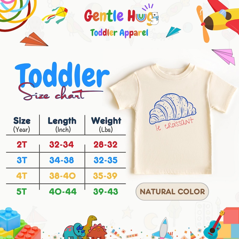 May include: A cream-colored toddler t-shirt with a blue and red croissant graphic and the text "le croissant". The shirt is displayed with a size chart showing length in inches and weight in pounds.