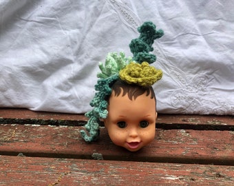 Crochet Succulents in a Baby Doll Head Planter