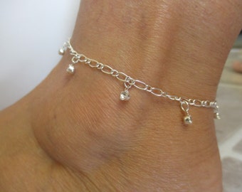 Anklet Silver Plated Chain with seven rhinestone dangling beads. Measures from 9" up to 10" with extending clasp. Can request size you need.