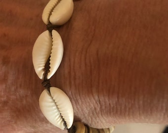 Shell Bracelet. Unisex. Cowrie and Coconut Shell Beads. Hand Knotted on Dark Taupe Cord. Non Metal and Waterproof. One size fits Most.