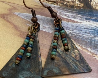 Copper Patina Triangular Earrings. Tiny Czech glass beads in earth colors adorn the front of these unique earrings.Measures 1 inch in length