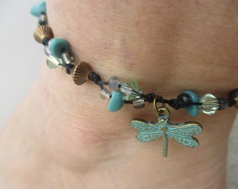 Anklet Dragonfly Brass Turquoise Painted. Crystal, brass and glass beads. Hand knotted on Black Cord. Adjusts in size from 7.5" up to 10.5".