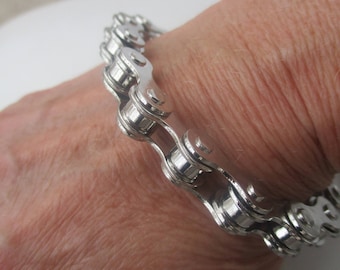 Bicycle Chain Bracelet. Silver Plated Metal. Measures 8  up to a 8 1/2". More length can be added if requested when ordering.