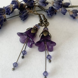 Purple Flower Earrings. Swarovski Genuine purple crystals with Antique Bronze Ear Wires and Components. Deep Purple Lucite flower petals.