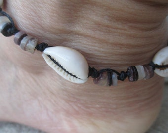 Anklet Cowrie Shells and Brown/black Tortoise Heishe Beads. Hand knotted on Black Cord. Adjusts 11.5" to 16 1/4". Waterproof. Non Metal.