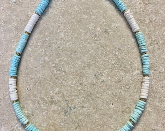 Puca Shell Necklace. Blue and White puca Shell beads with gold bead accents. Shell bead centers the middle. 16.5”with a 1.5” extender chain.